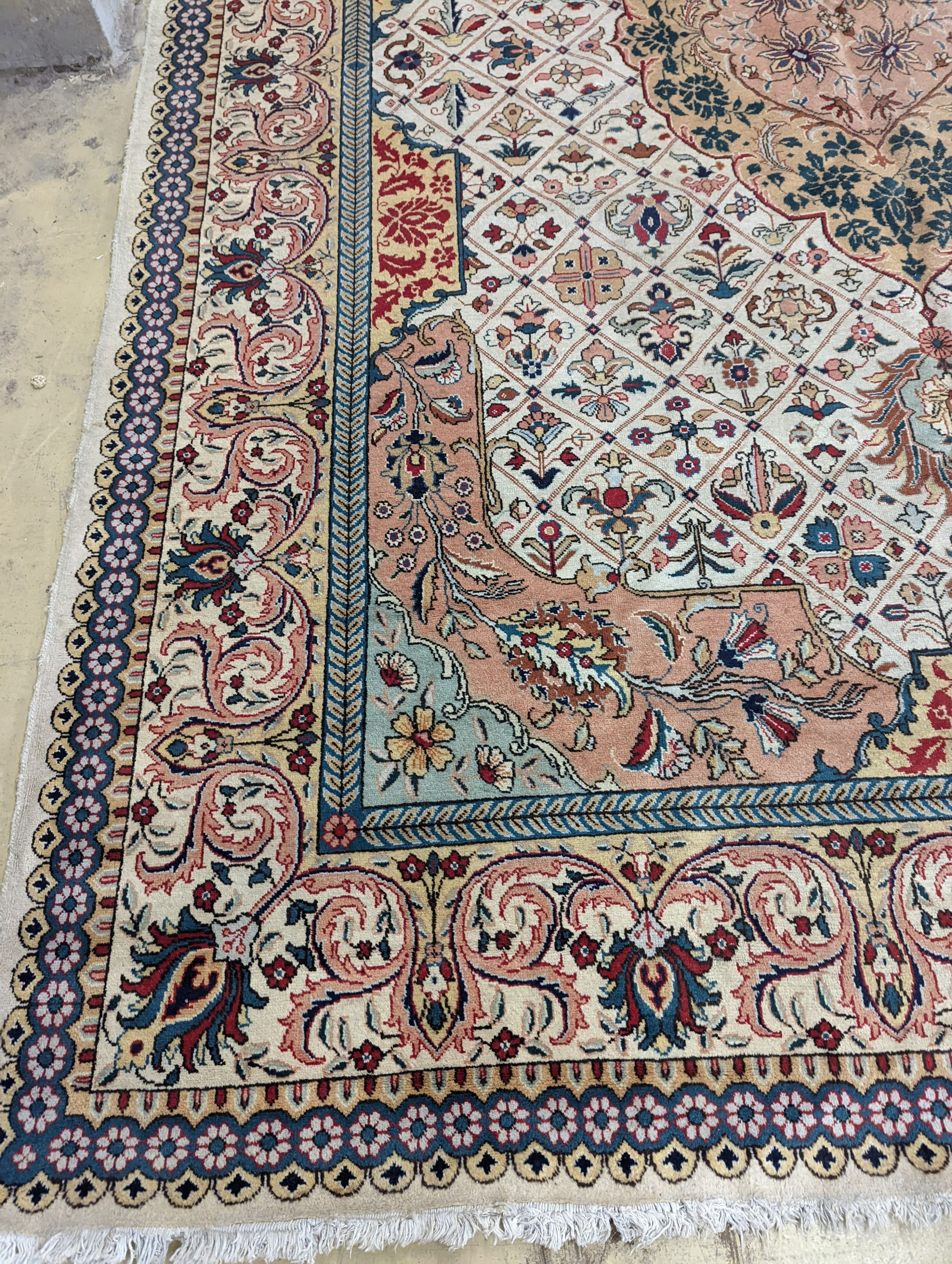 A Tabriz ivory ground carpet, 425 x 306cm